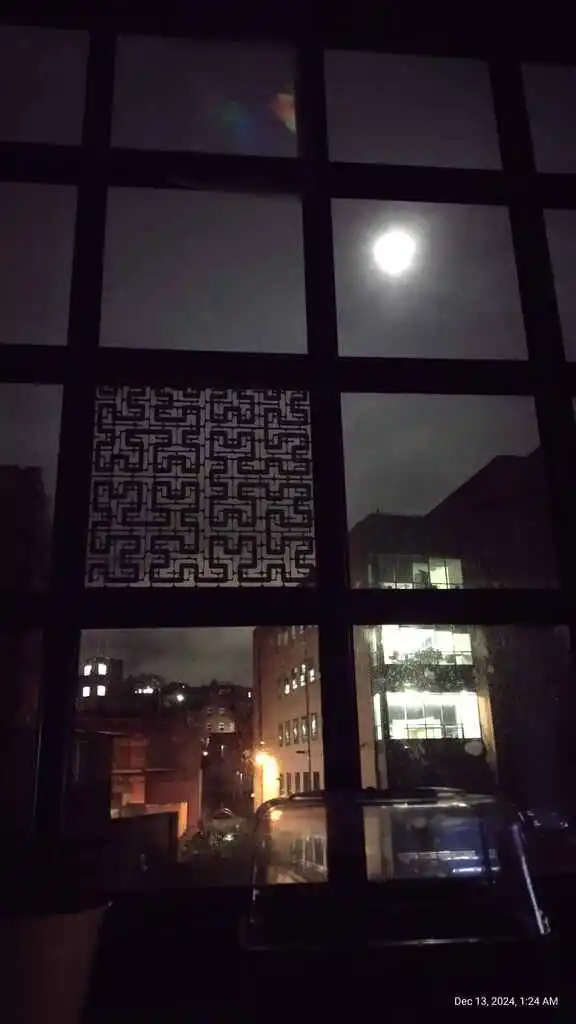 picture of a window with laser cut pattern in one of the window panes